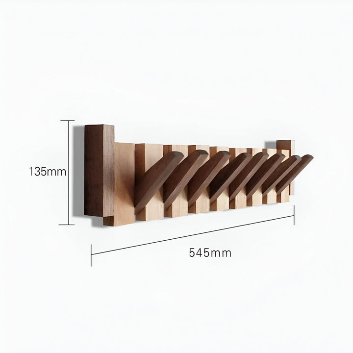 Träklädhängare med innovativ pianodesign. En modern hallmöbel och praktisk förvaringskrok för inredning.