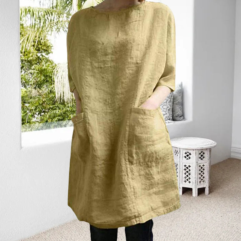 "Elegant kvinnoklänning i bomull-linne, rund hals, knälång, vårig design, drop shoulder ärmar, bekväm passform."