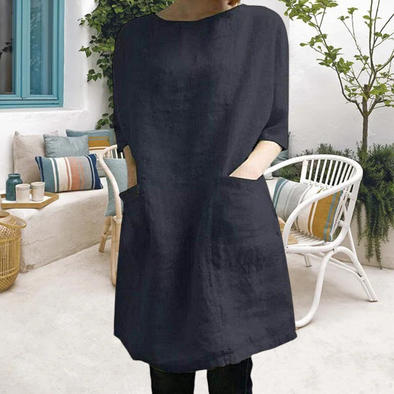 "Elegant kvinnoklänning i bomull-linne, rund hals, knälång, vårig design, drop shoulder ärmar, bekväm passform."