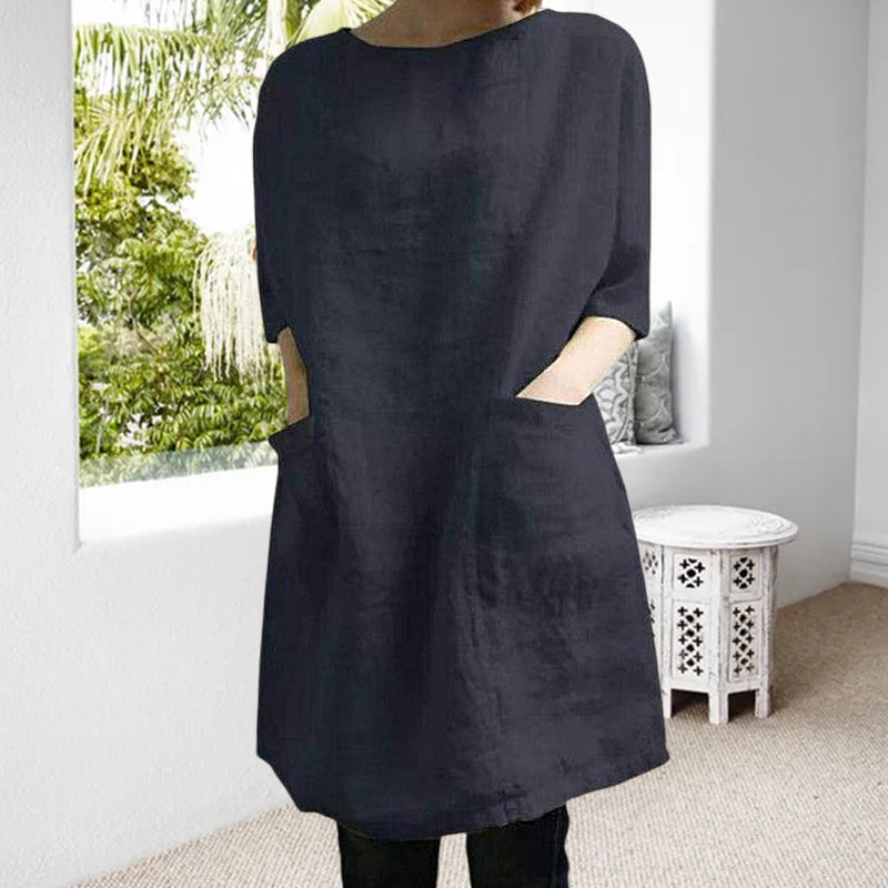 "Elegant kvinnoklänning i bomull-linne, rund hals, knälång, vårig design, drop shoulder ärmar, bekväm passform."