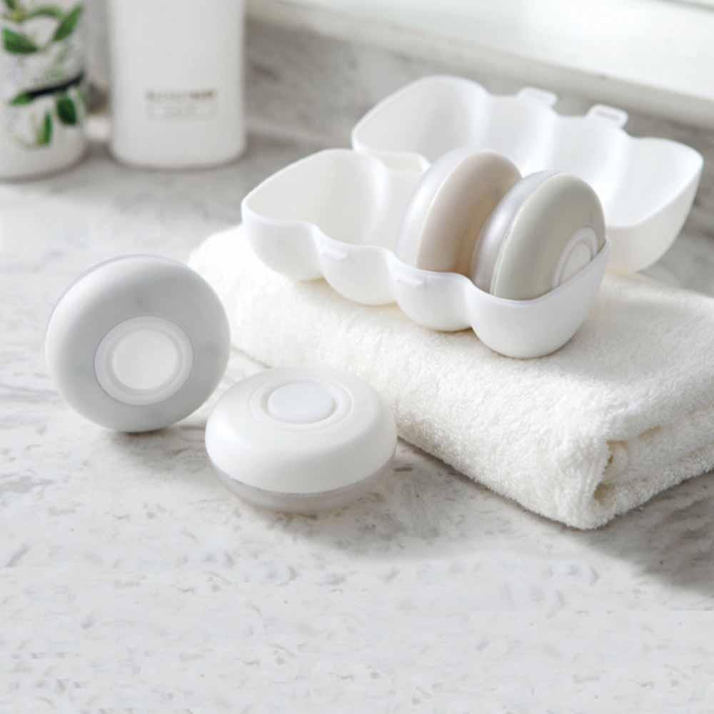 "Elegant läckagesäker reseförpackning, kompakt design, perfekt för handbagage, fyra färger, tillbehör resor."