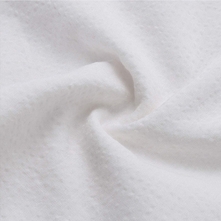Elegant långärmad damtop i spetsbroderad bomull, vit, mjuk textur, feminin och sofistikerad design för alla tillfällen.