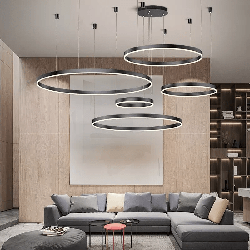 Elegant LED-pendellampa med modern design, inspirerad av sol och måne. Perfekt för vardagsrummet.