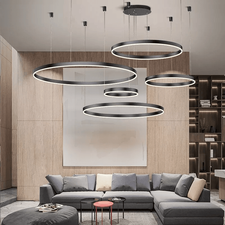 Elegant LED-pendellampa med modern design, inspirerad av sol och måne. Perfekt för vardagsrummet.