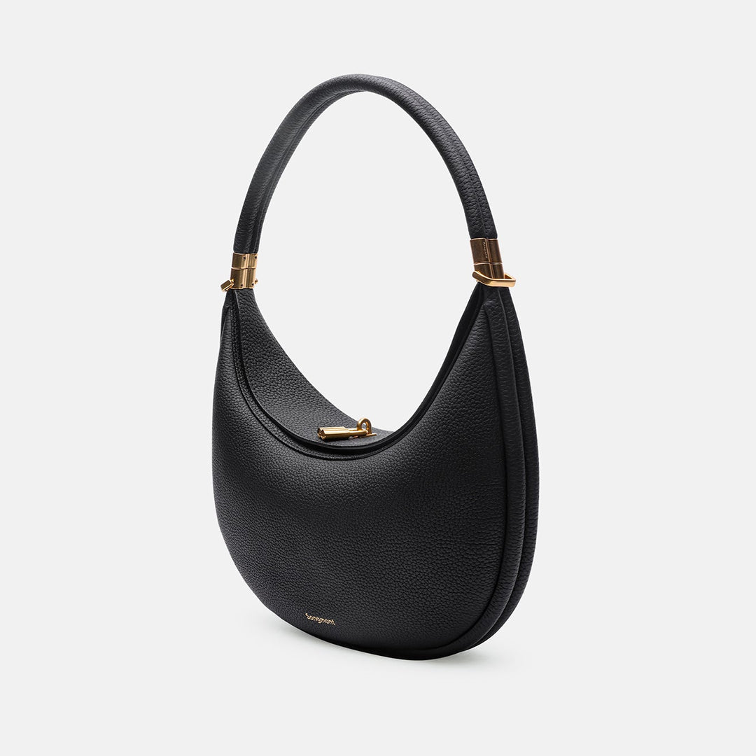 Luna axelremsväska i brunt fullnarvsläder. En mångsidig och tidlös crossbodyväska för en elegant stil.