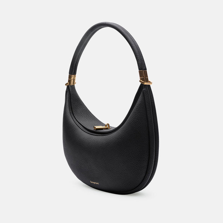 Luna axelremsväska i brunt fullnarvsläder. En mångsidig och tidlös crossbodyväska för en elegant stil.