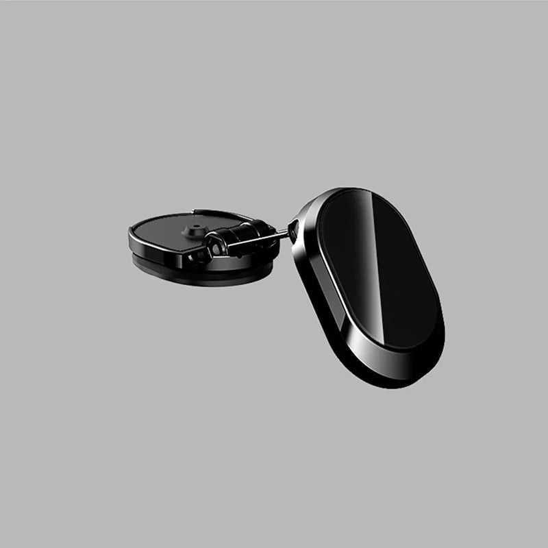 "Elegant magnetisk biltelefonhållare med starkt magnetfäste, 360° rotation, i svart design på bilens instrumentbräda."