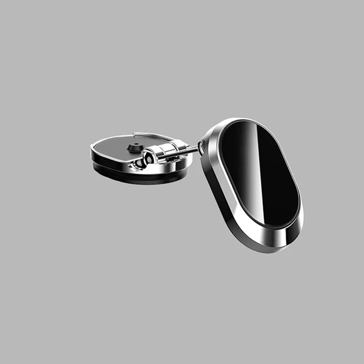 "Elegant magnetisk biltelefonhållare med starkt magnetfäste, 360° rotation, i svart design på bilens instrumentbräda."