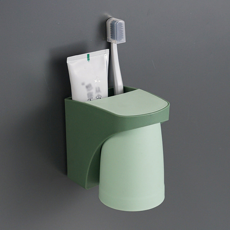 "Elegant magnetisk tandborsthållare med munvattenkopp i kompakt design, dammtät och vattentät för moderna badrum."