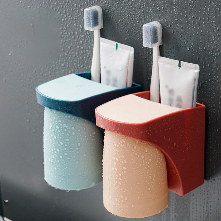 "Elegant magnetisk tandborsthållare med munvattenkopp i kompakt design, dammtät och vattentät för moderna badrum."
