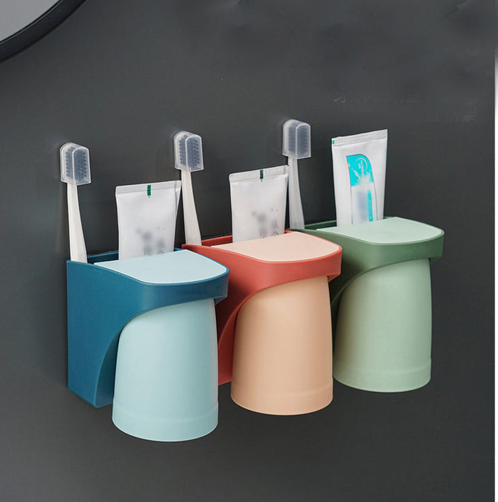 "Elegant magnetisk tandborsthållare med munvattenkopp i kompakt design, dammtät och vattentät för moderna badrum."