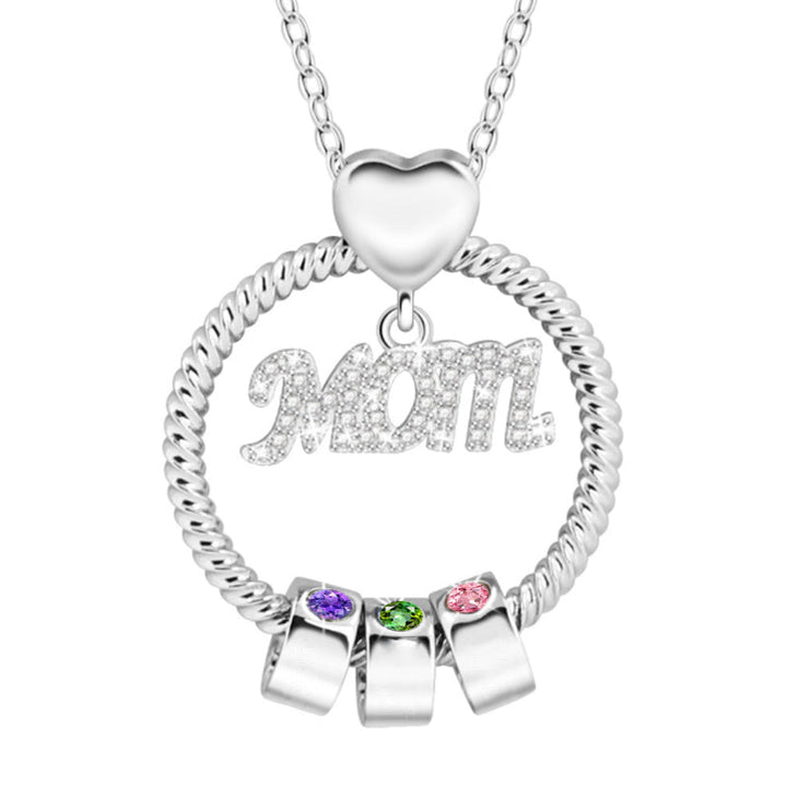 "Elegant mammas halsband med födelsesten i gyllene färg, intrikat hjärtdesign och tvinnad repdetalj för kvinnor."