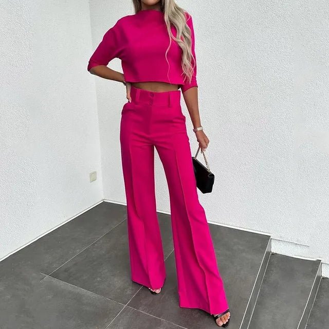 Snyggt dammode med matchande crop top & byxor med hög midja, idealiskt för en elegant look.