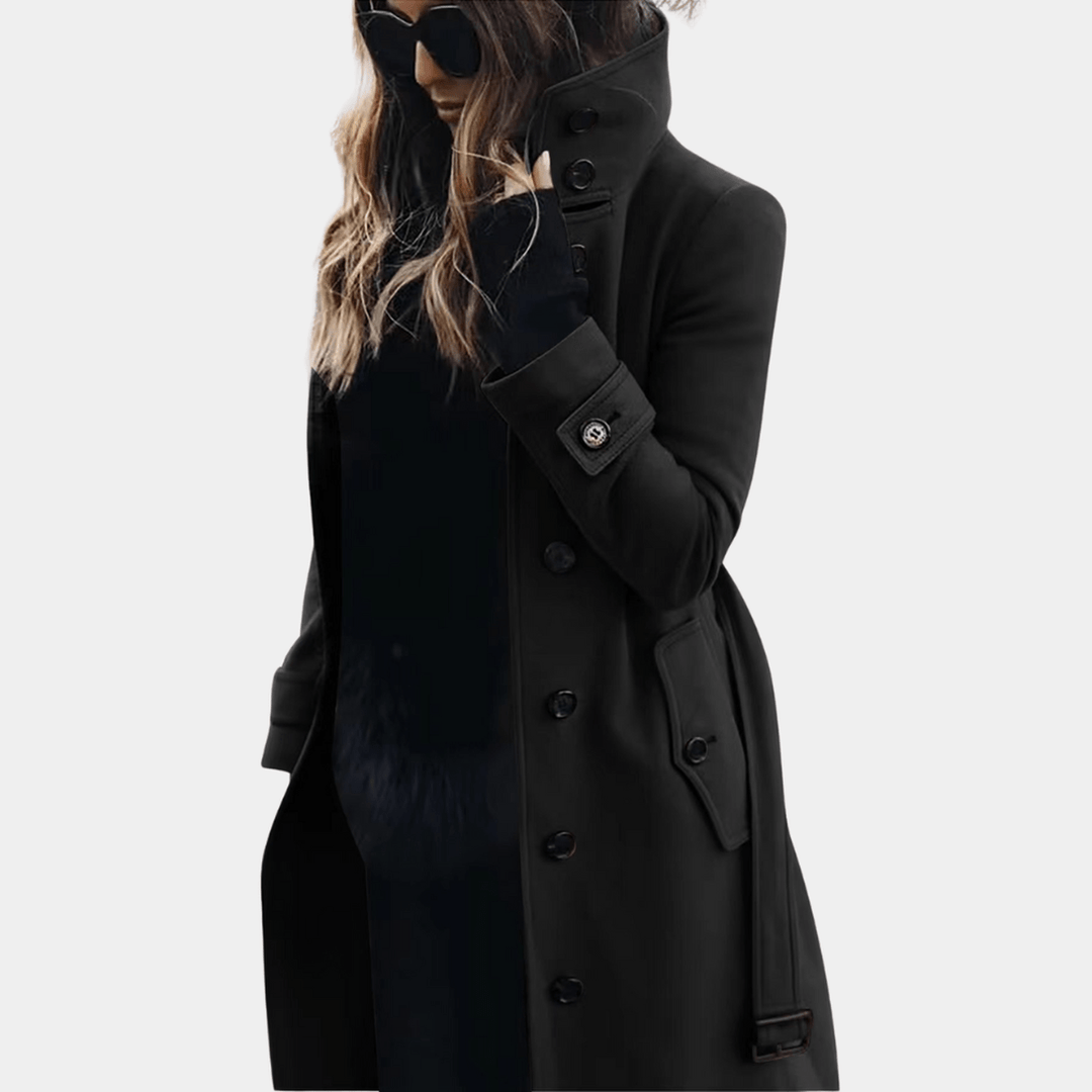 Elegant midjesydd trenchcoat för dam. Lång, klassisk ytterplagg för stilfull värme under höst och vinter.