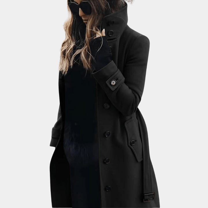 Elegant midjesydd trenchcoat för dam. Lång, klassisk ytterplagg för stilfull värme under höst och vinter.