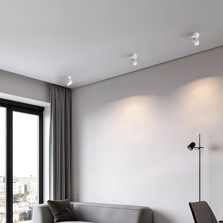 Vardagsrumsbelysning: Modern LED taklampa med justerbara spotlights.