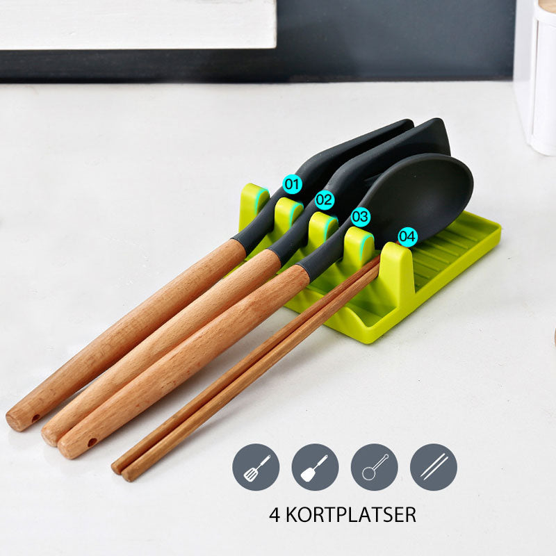 "Elegant multifunktionellt köksspatelställ med halkfri bas och infällda hål, tillgänglig i grön, vit och grå färg."