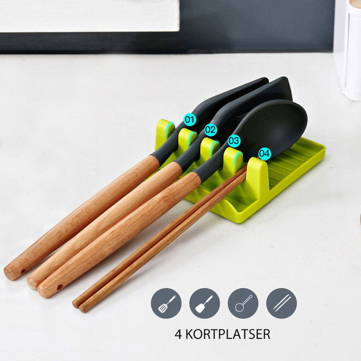"Elegant multifunktionellt köksspatelställ med halkfri bas och infällda hål, tillgänglig i grön, vit och grå färg."