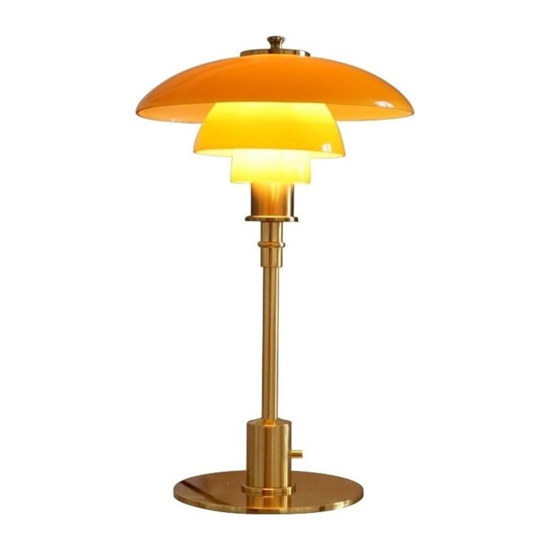 Amberfärgad LED bordslampa i glas med nordisk design, vacker belysning.