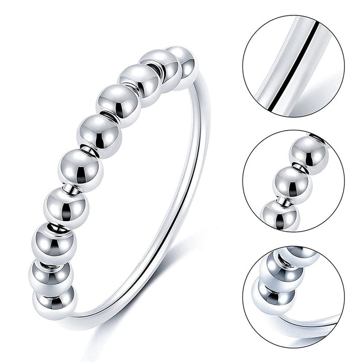 "Elegant och justerbar ångestring i silver för damer, med roterbar design för stil och stresslindring."