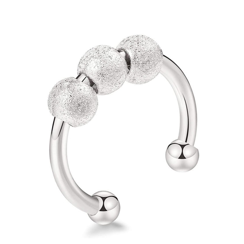 "Elegant och justerbar ångestring i silver för damer, med roterbar design för stil och stresslindring."