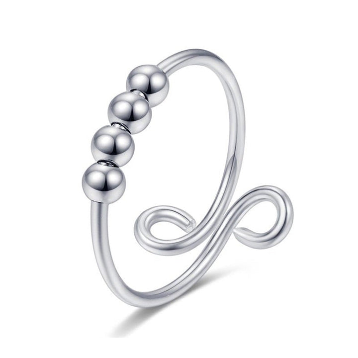 "Elegant och justerbar ångestring i silver för damer, med roterbar design för stil och stresslindring."