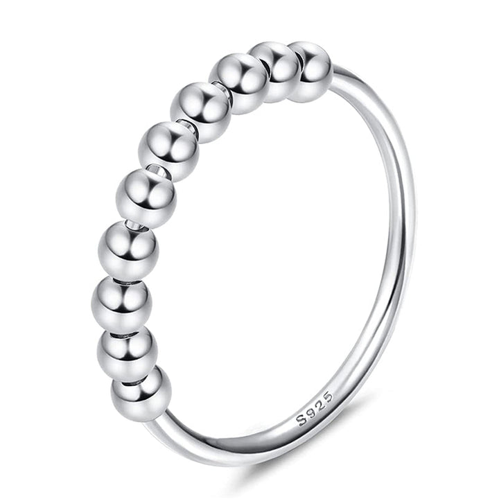 "Elegant och justerbar ångestring i silver för damer, med roterbar design för stil och stresslindring."