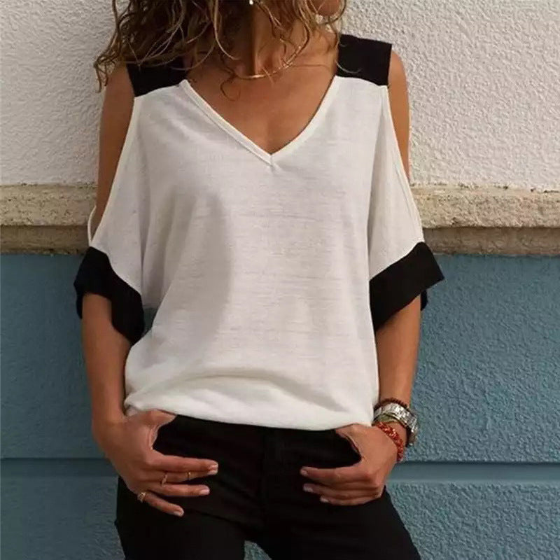 "Elegant off-shoulder V-ringad damblus i bomull, mjukt material med kontrasterande färger, perfekt för alla tillfällen."