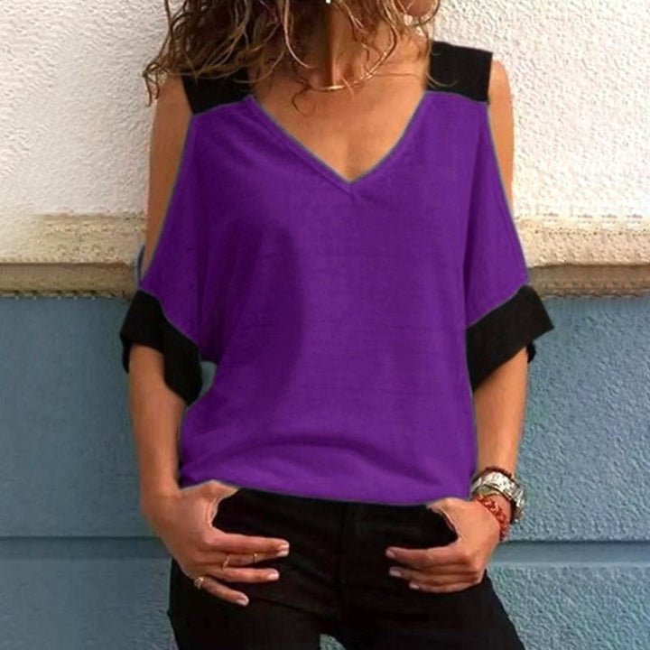 "Elegant off-shoulder V-ringad damblus i bomull, mjukt material med kontrasterande färger, perfekt för alla tillfällen."