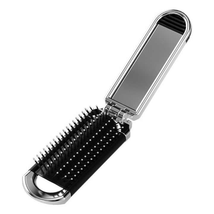 "Elegant resevänlig silver spegelhårborste, unisex design, kompakt och hopfällbar med spegel för enkel stiljustering."