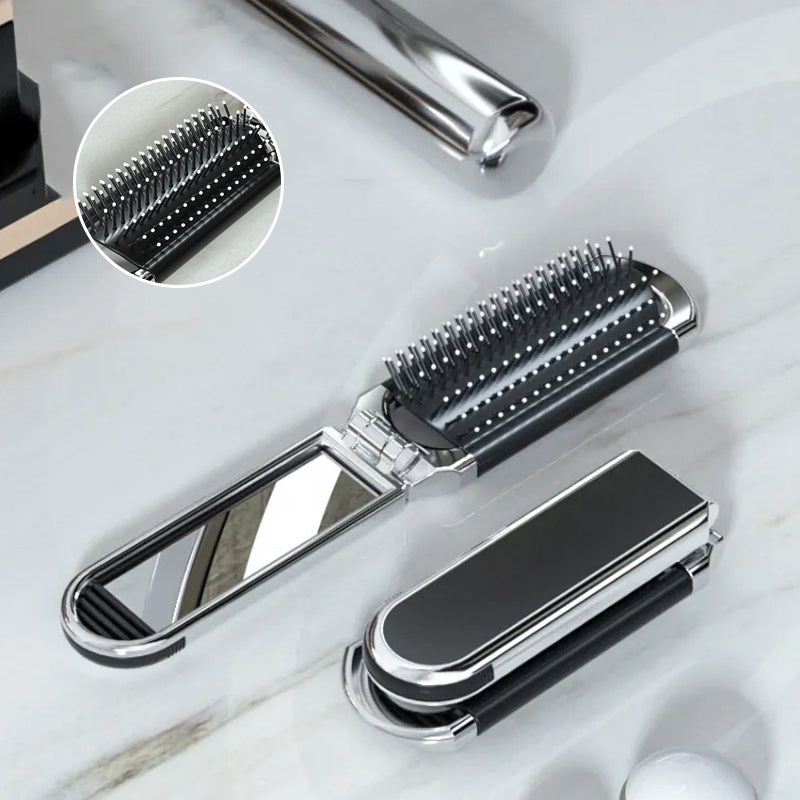 "Elegant resevänlig silver spegelhårborste, unisex design, kompakt och hopfällbar med spegel för enkel stiljustering."