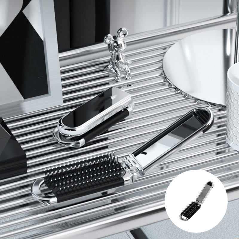 "Elegant resevänlig silver spegelhårborste, unisex design, kompakt och hopfällbar med spegel för enkel stiljustering."