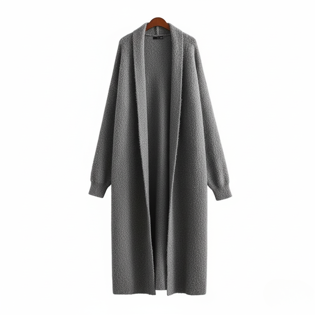 Närbild på ärmdetaljen hos en blå dam långkofta, betonar dess komfort och eleganta stil.