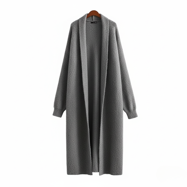 Närbild på ärmdetaljen hos en blå dam långkofta, betonar dess komfort och eleganta stil.