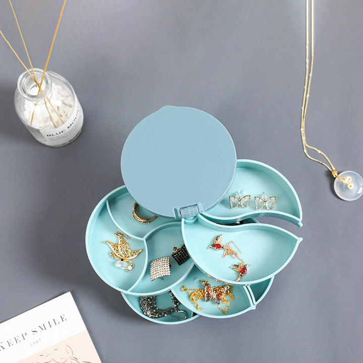 "Elegant roterande smyckesskrin med flera lager, spegel och LED-belysning för smidig och lyxig smyckesförvaring."