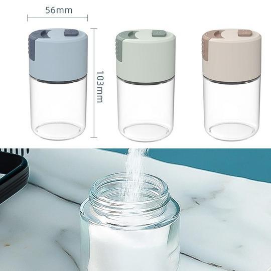 "Elegant saltkar i glas med mätfunktion, böjd form och modernt lock, perfekt för kryddförvaring i köket."