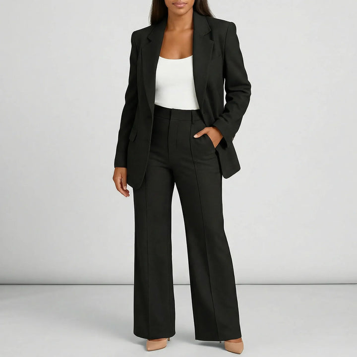Lauren byxkostymset för dam: elegant skräddarsytt med högmidja och vidben. Perfekt för en professionell stil.