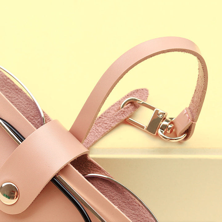 "Elegant solglasögonväska i mjukt PU-läder med metalltryckknapp, finns i rosa, svart, grå, vit, för damaccessoarer."