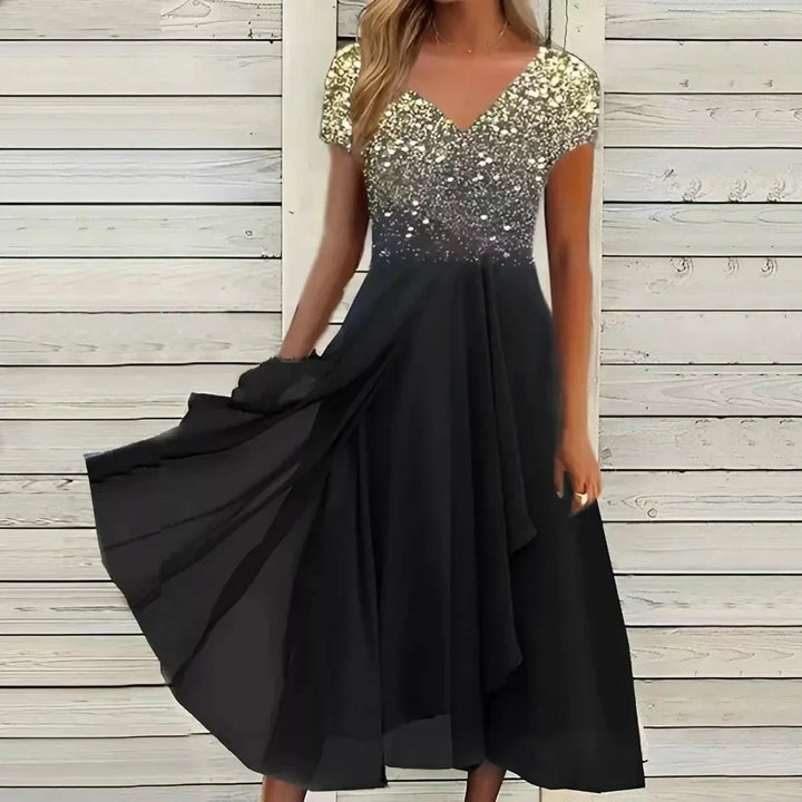 Soraya kvinnors sommarklänning, elegant och bekväm vardagslyx i feminin midi-modell.
