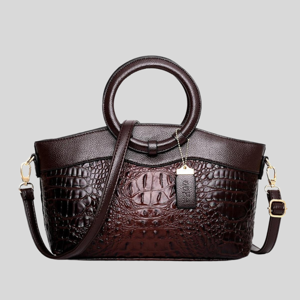 Elegant strukturerad Leah handväska. Svart damväska som kan bäras som axelremsväska eller crossbodyväska.
