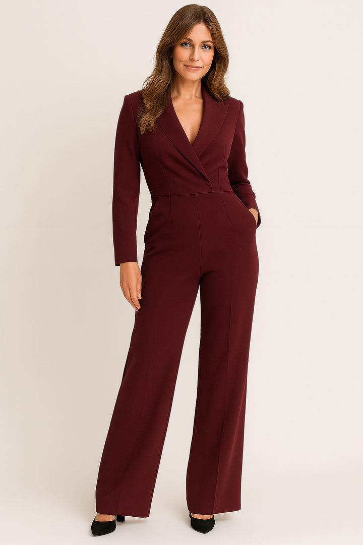 Elegant svart damjumpsuit med lång ärm & figursydd midja. Perfekt för fest & stilrena vardagslooken.