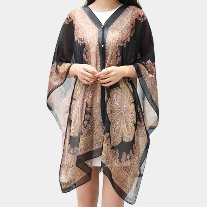 Elegant svart höstponcho för dam, mångsidig sjal i flödande design, perfekt modeaccessoar.