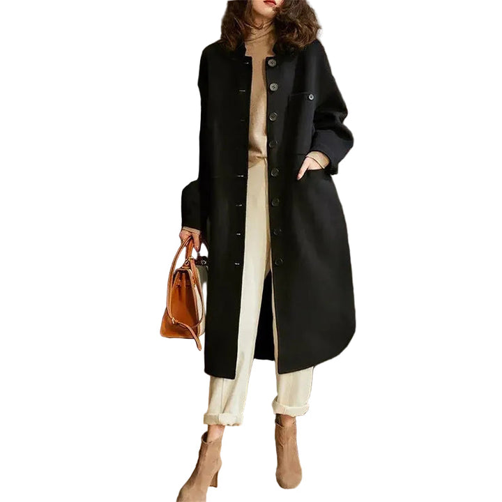 Elegant svart kvinnors vår trenchcoat, lång modell med bälte, perfekt för modemässiga ytterplagg.