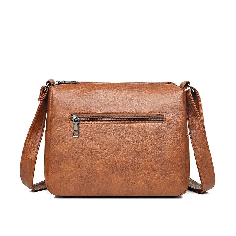 Multifunktionell elegant brun axelväska för dam, rymlig crossbody och stilren vardagsaccessoar.