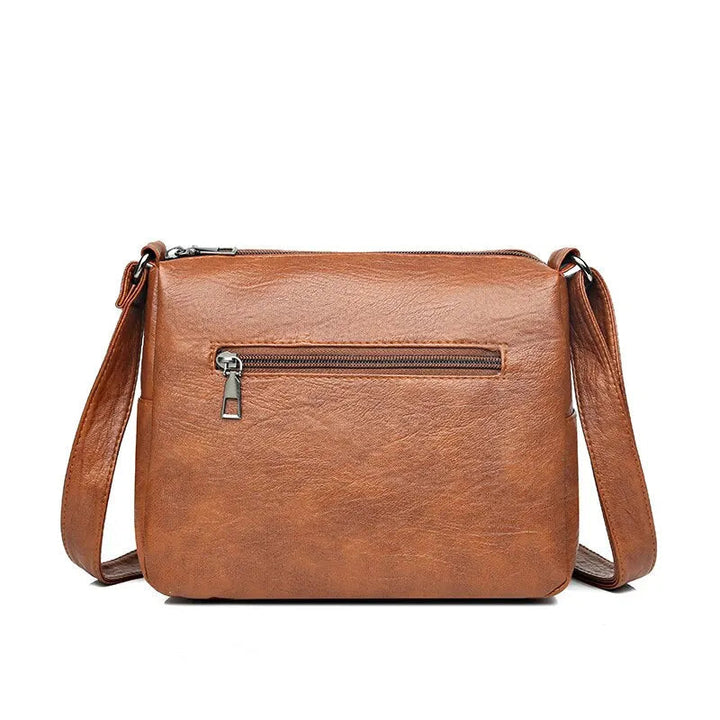 Multifunktionell elegant brun axelväska för dam, rymlig crossbody och stilren vardagsaccessoar.