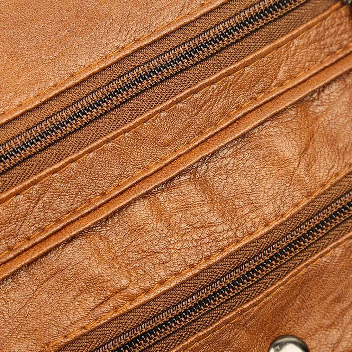 Elegant och rymlig messenger väska för kvinnor, i svart eller brunt, stilren vardagsaccessoar.