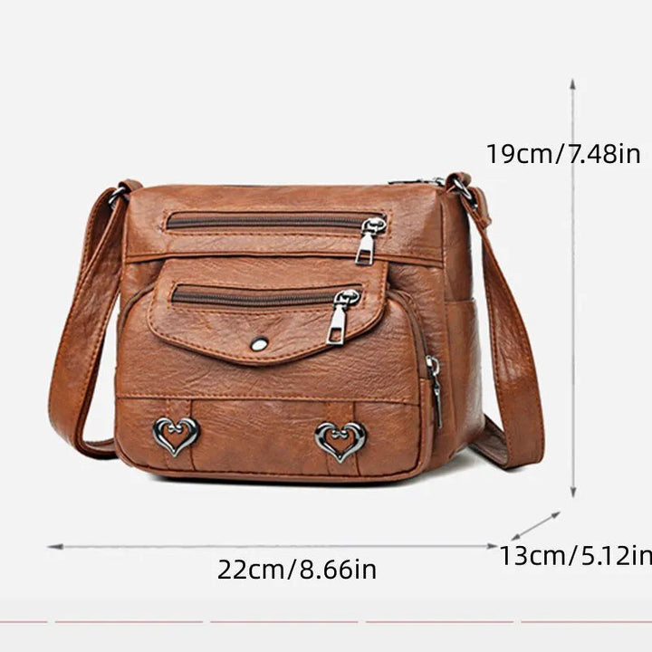 Tidlös elegant svart damväska, rymlig messenger för alla säsonger, stilren modeaccessoar.