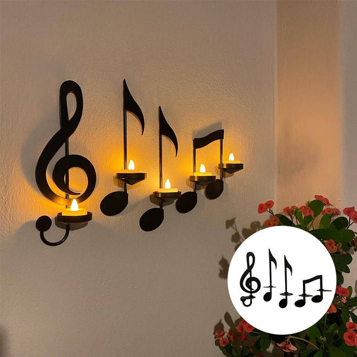 "Elegant svart metall väggmonterad musiknot ljusstake; kombinerar musikinspirerad design med stilfull dekoration."