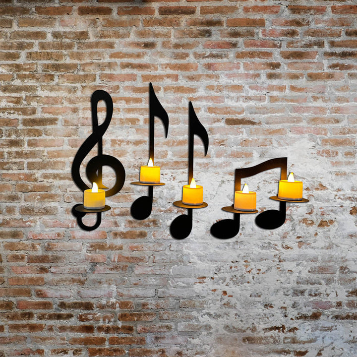 "Elegant svart metall väggmonterad musiknot ljusstake; kombinerar musikinspirerad design med stilfull dekoration."