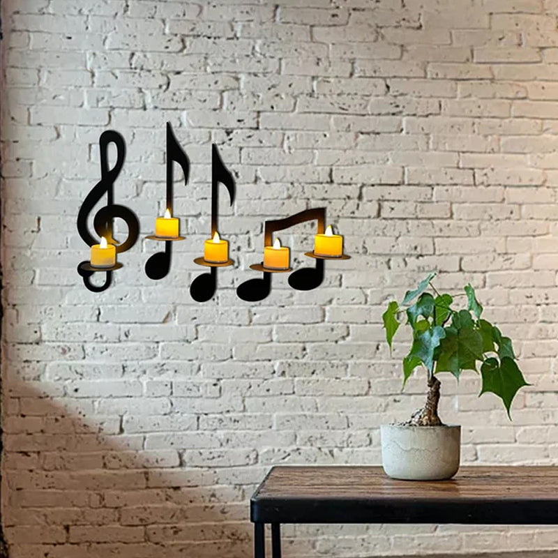 "Elegant svart metall väggmonterad musiknot ljusstake; kombinerar musikinspirerad design med stilfull dekoration."